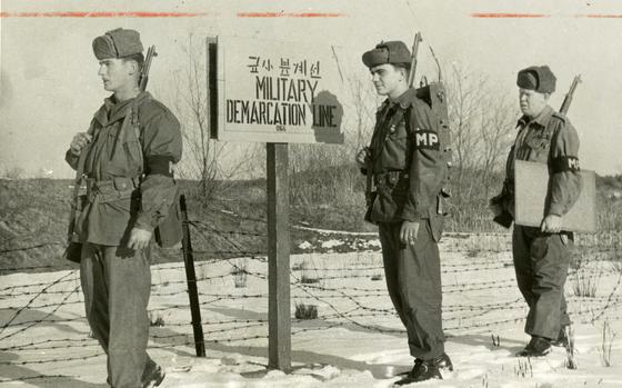 Demilitarized Zone, South Korea, December 1956: The 24th Divisions DMZ Police Company's  PFC Winston Mullinax (left), acts as observer on a patrol with SP3 Robert A. Bianchi, radio operator, and PFC Jerome Gillmore, patrol leader. They pulled “stationary guard” on a “small OP’ near the demilitarized zone in Korea. 

Pictured here is a scan of the original 1956 print created by Stars and Stripes Pacific's photo department to run in the print newspaper. The red marks indicate the crop lines. Only the middle part of the image would appear in the newspaper. As the vast majority of pre-1964 Stars and Stripes Pacific negatives and slides were unwittingly destroyed by poor temporary storage in 1963, the prints developed from the late 1940s through 1963 are the only images left of Stripes' news photography from those decades – with the exception the negatives of some 190 pre-1964 photo assignment found recently. Stars and Stripes' archives team is scanning these prints and negatives to ensure their preservation. 

Looking for Stars and Stripes’ historic coverage? Subscribe to Stars and Stripes’ historic newspaper archive! We have digitized our 1948-1999 European and Pacific editions, as well as several of our WWII editions and made them available online through https://starsandstripes.newspaperarchive.com/

META TAGS: DMZ; The 24th Div. DMZ Police Co.; South Korea