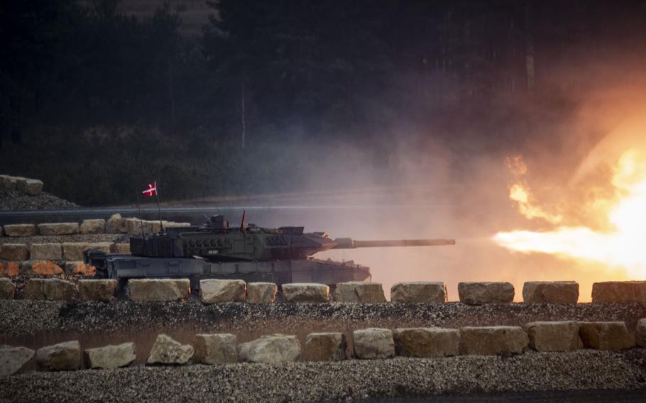 A Danish tank crew fires a Leopard.