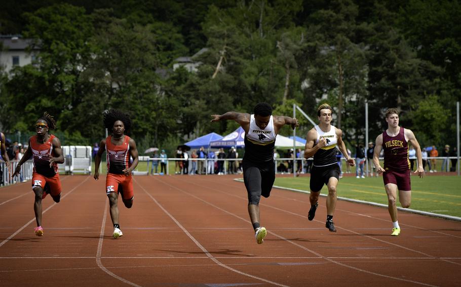 Stuttgart’s Alex Guthrie surges over the finish line to win the boys 200-meter finals, followed closely by teammate Daniel Greer, at the 2024 DODEA European Championships at Kaiserslautern High School in Kaiserslautern, Germany, on May 24, 2024. Both athletes achieved personal records, with Guthrie at 22.54 seconds and Greer at 23.03 seconds.