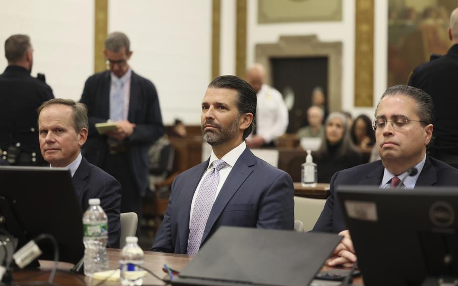 Donald Trump Jr. sits in the courtroom with his legal team before the continuation of the civil business fraud trial at New York Supreme Court, Monday, Nov. 13, 2023, in New York. 