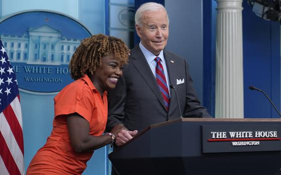 President Joe Biden shares a laugh with White House press secretary Karine Jean-Pierre when Biden made a surprise appearance during the daily briefing at the White House in Washington, Friday, Oct. 4, 2024. (AP Photo/Susan Walsh)