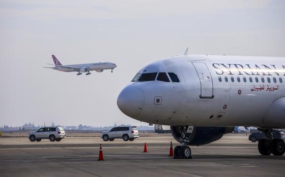 A Turkish Airlines commercial flight lands at Damascus international airport from Istanbul, in Damascus, Syria, Thursday, Jan. 23, 2025. (Ahmet Arslan/IHA via AP)