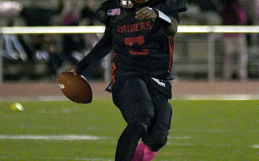 Rueben Todman points to an open spot on the field.