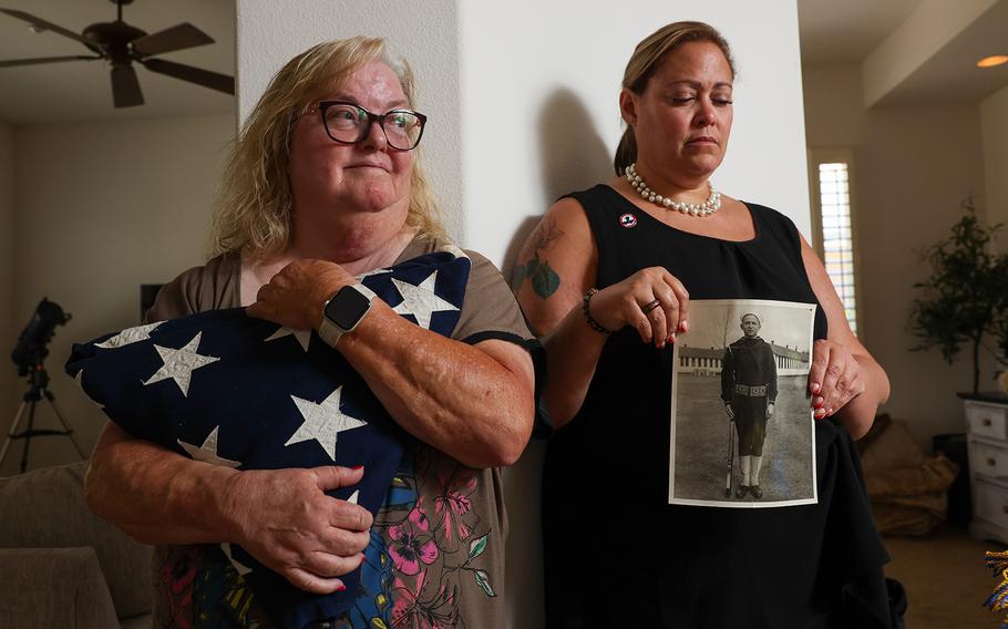 Lora Parrish, left, and sister April McKinnon hold onto mementos of Everett Titterington’s life