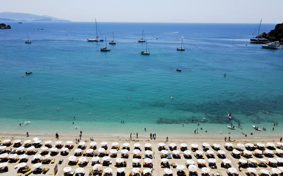 In this aerial view, vacationers stretch out on lounge chairs on July 28, 2024, in Parga, Greece. (Milos Bicanski/Getty Images/TNS)