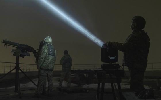 Mriya volunteers try to spot drones approaching Kyiv. MUST CREDIT: Sasha Maslov for The Washington Post