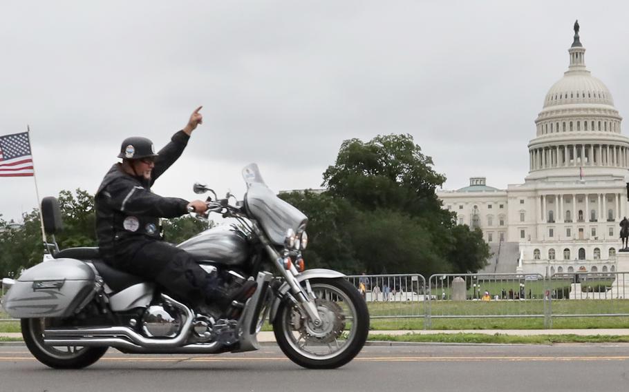 Motorcyclists taking part in the Rolling to Remember ride through Washington, D.C. pass the U.S. Capitol on May 30, 2021.