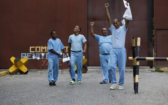 FILE - People detained during a government crackdown following anti-government protests against the results of the presidential election walk out of the Yare 3 prison upon their release, in San Francisco de Yare, Venezuela, Nov. 16, 2024. (AP Photo/Cristian Hernandez, File)