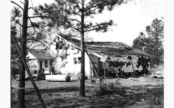 The back of the Gregg house after the detonation in 1958.