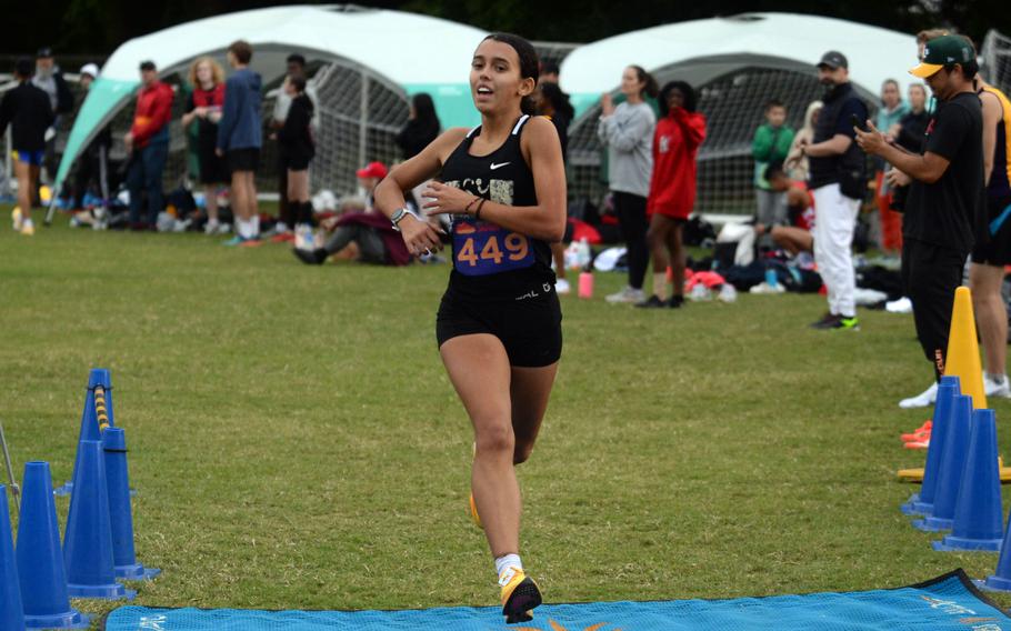 Cassandra Jarzabek crosses the finish line.