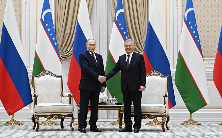 Russia President Vladimir Putin and Uzbekistan President Shavkat Mirziyoyev pose for a photo before their meeting at the Kuksaroy Presidential Palace in Tashkent, Uzbekistan, on Monday, May 27, 2024. 