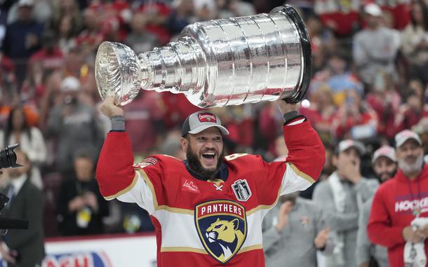 Kyle Okposo celebrates with the Stanley Cup after the Panthers defeated the Oilers in Game 7 on June 24, 2024.