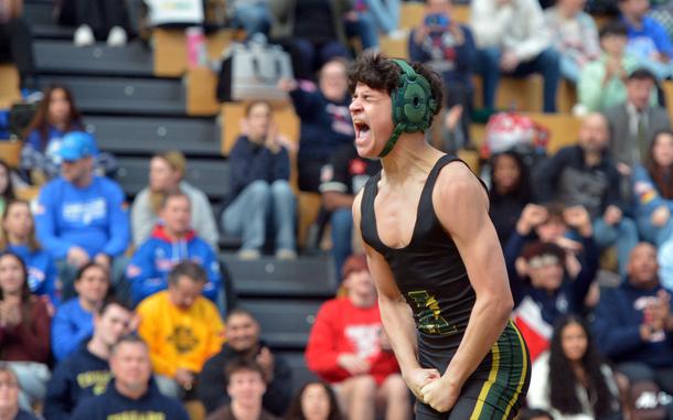 Alconbury's Edison Vega Figueroa celebrates his 113-pound boys title after defeating Vicenza's Kyler Mukal at the DODEA-Europe wrestling championships Feb. 8, 2025, in Wiesbaden, Germany.