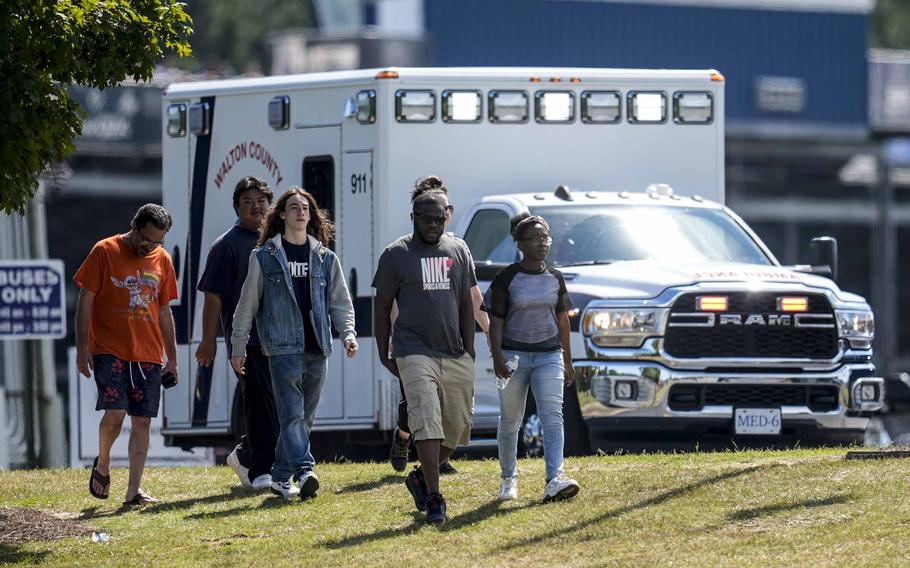 Students and parents at the campus of Apalachee High School, the site of a shooting