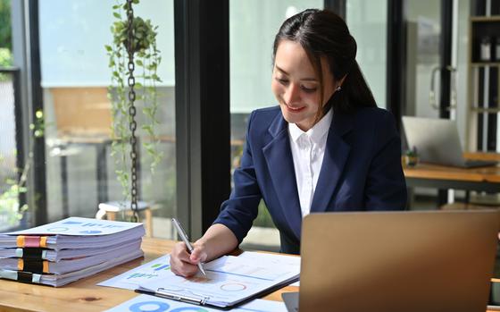 Businesswoman working with laptop computer in modern office