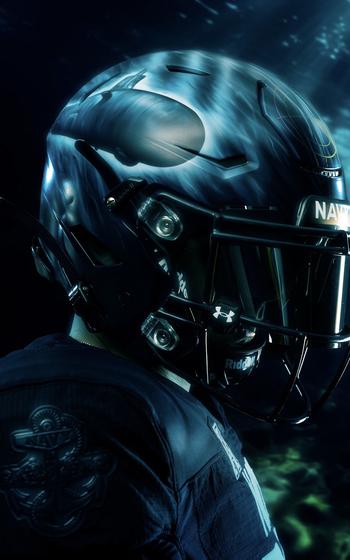 A Navy player’s helmet bears the image of a submarine.