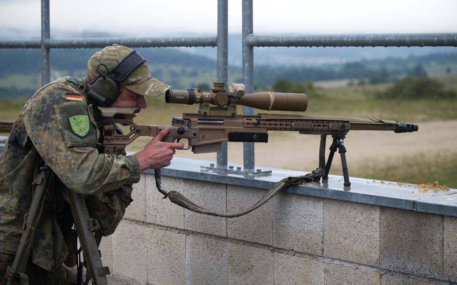 A German sniper prepares to fire from a rooftop during the eighth annual European Best Sniper Team Competition on Aug. 8, 2024, at the Joint Multinational Readiness Center in Hohenfels, Germany.