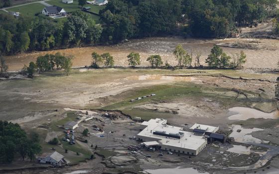 An aerial view of flood-damaged Unicoi County Hospital in the aftermath of Hurricane Helene, Saturday, Sept. 28, 2024, in Erwin, Tenn. (AP Photo/George Walker IV)