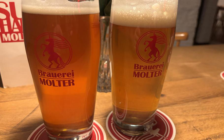 Two full beers in glasses