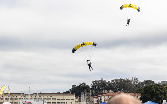 The Leap Frogs, the U.S. Navy Parachute Team, soar above Marina Green park in San Francisco.