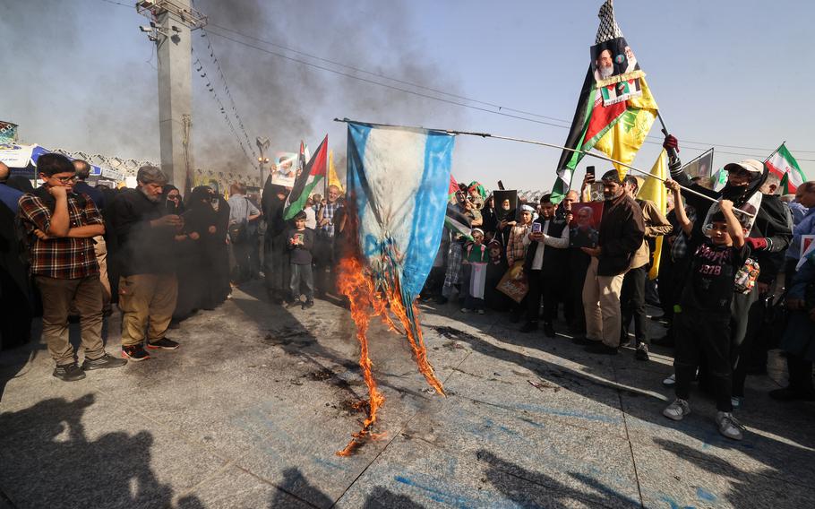 An Israeli flag is burned during a rally in Tehran, Iran, on Oct. 2, 2024. 