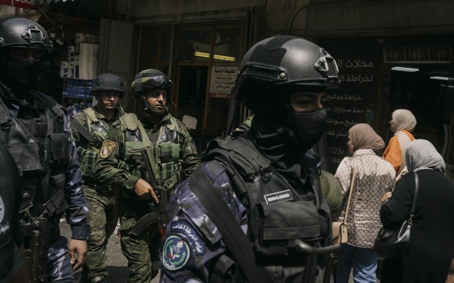 Members of the police special forces and Palestinian army patrol in central Ramallah. 