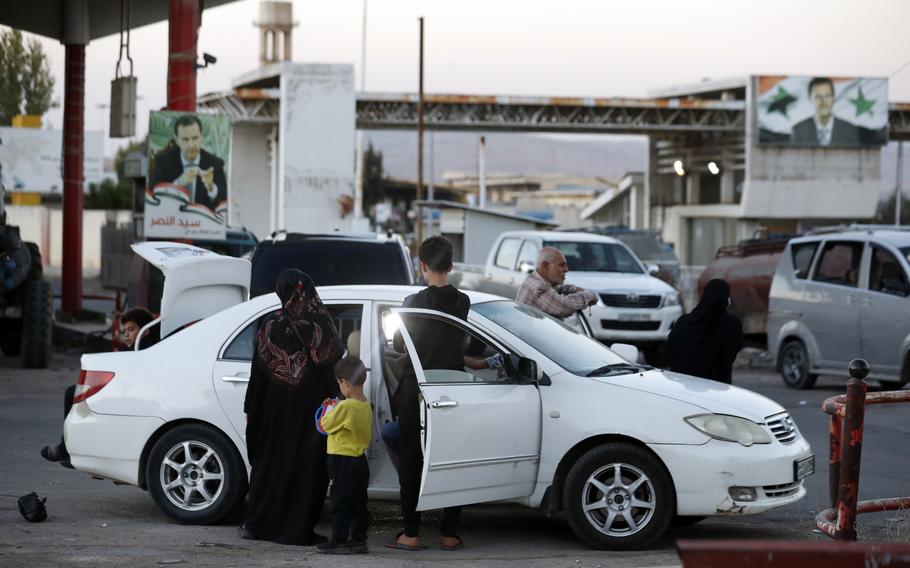 Lebanese fleeing the Israeli bombardment, arrive in a taxi at the Syrian-Lebanese border crossing in Jdaidet Yabous, Syria.