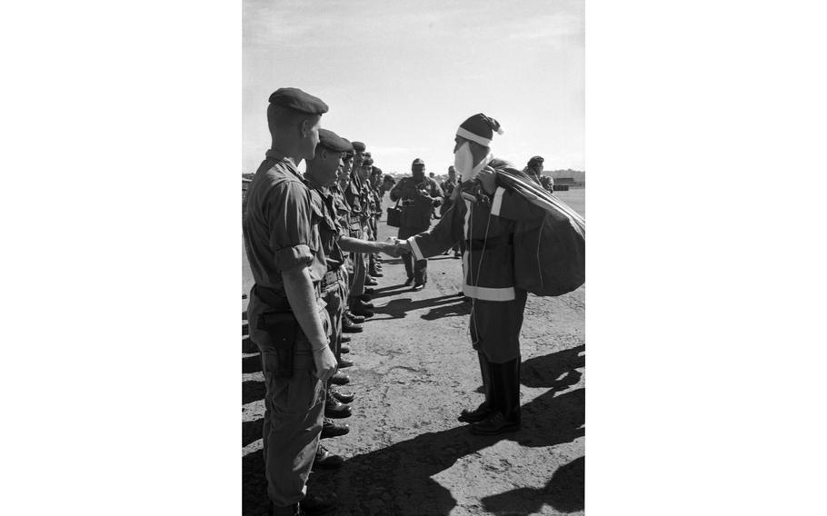 Santa wishes the men of Detachment 35, “B” Company, 5th Special Forces Group a Merry Christmas just after he leaves the plane.