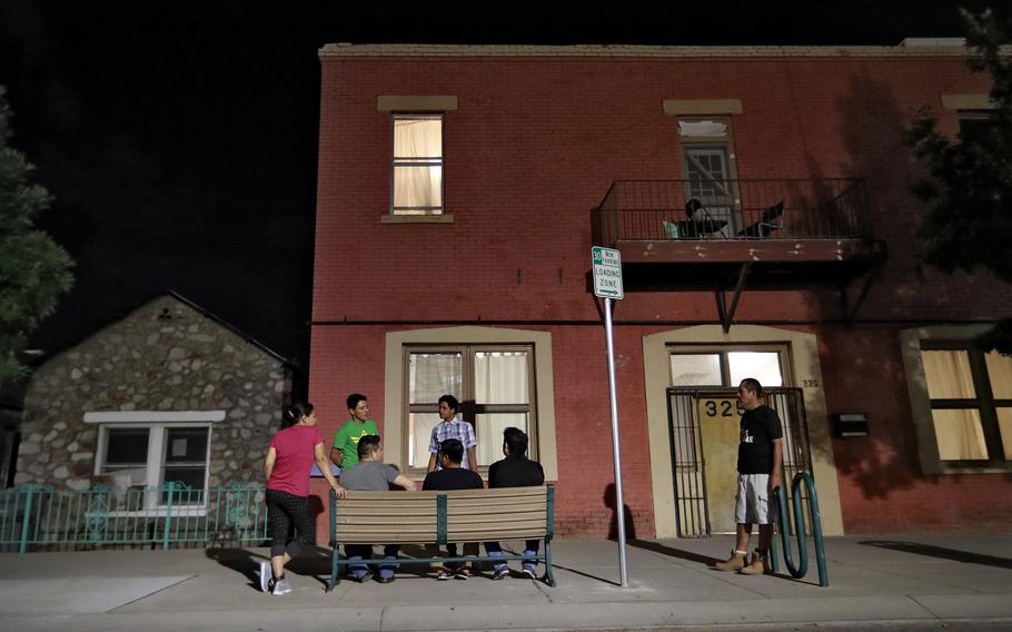 Migrant parents gather outside the Annunciation House in El Paso, Texas, in June 2018.