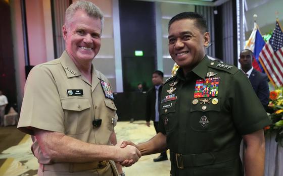 U.S. Indo-Pacific Command Commander Admiral Samuel Paparo, left, and Philippines military chief Gen. Romeo Brawner Jr., during an international military conference organized by the U.S. Indo-Pacific Command on Tuesday, Aug. 27, 2024, in Manila, Philippines. (AP Photo/Aaron Favila)