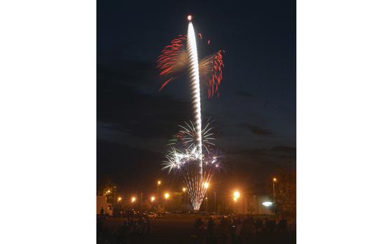 RAF Alconbury, England, July 2, 2006: Fireworks brighten up the night sky as onlookers admire the spectacle in front of RAF Alconbury's commissary. The fireworks capped off the base's Fourth of July celebration on July 2.      

META DATA: Fourth of July; Independence Day; July 4th; American holiday; fireworks