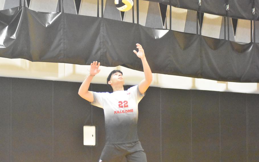 American Overseas School of Rome’s Iker Santos tosses the ball up while serving Thursday, Oct. 26, 2023, at the DODEA-Europe boys volleyball championships.