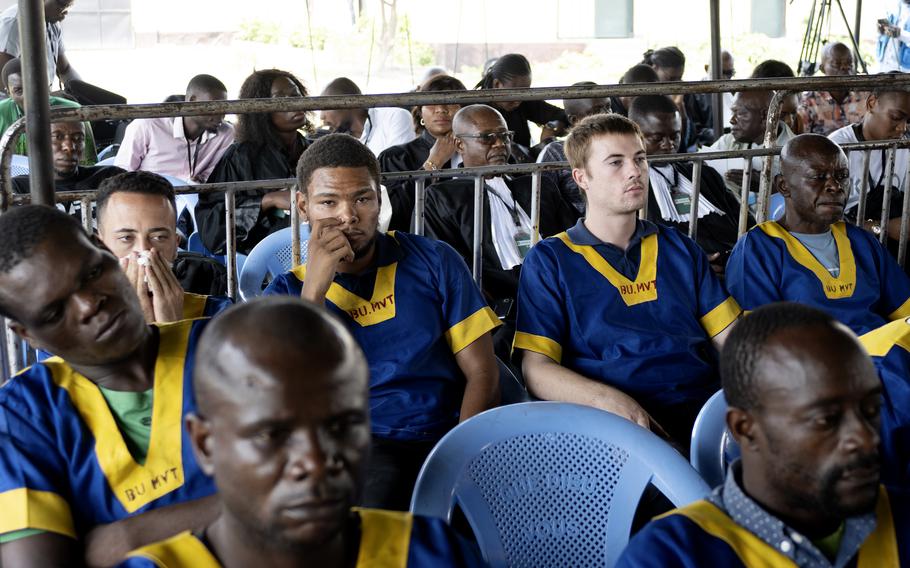 Along the back row shows from left; Benjamin Reuben Zalman-Polun, Marcel Malanga and Tyler Thompson, all American citizens, attend a court verdict in Congo, Kinshasa.