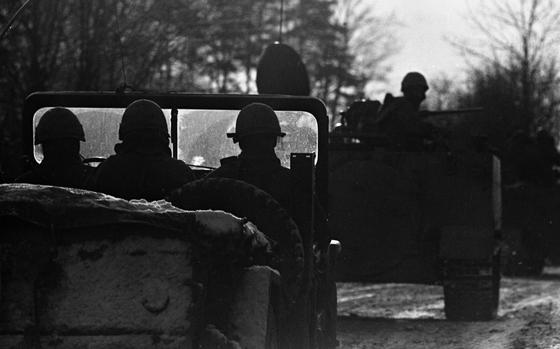 Grafenwoehr, Germany, Feb. 3, 1969: Infantry troops taking part in the Carbide Ice exercise are silhouetted against the morning sun as they roll through the village of Koenigstein in the Vilseck - Grafenwoehr area. 

Looking for Stars and Stripes’ historic coverage? Subscribe to Stars and Stripes’ historic newspaper archive! We have digitized our 1948-1999 European and Pacific editions, as well as several of our WWII editions and made them available online through https://starsandstripes.newspaperarchive.com/

META TAGS: Reforger; Reforger 1; NATO; exercise; training; Crested Cap; Air Force; Army; USAREUR; dual exercise; training; Carbide Ice;
