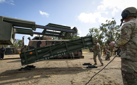FILE - In this image provided by the U.S. Army, Staff Sgt. Jimmy Lerma, crew chief for Alpha Battery, 1st Battalion, 3rd Field Artillery Regiment, 17th Field Artillery Brigade, adjusts the Army Tactical Missile System (ATACMS) for loading on to the High Mobility Artillery Rocket System (HIMARS) at Williamson Airfield in Queensland, Australia, on July 26, 2023. Ukraine is having some success in halting Russia's new push along the northeast front weeks after the decision allowing the country to use U.S.-supplied weapons for limited strikes in Russian territory. But commanders say their hands are tied without the ability to use long-range guided missiles, such as ATACMS. (Sgt. 1st Class Andrew Dickson/U.S. Army via AP)