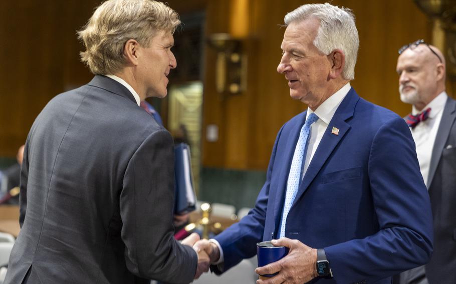 Sen. Tommy Tuberville, R-Ala.,right, greets Under Secretary of Defense nominee Elbridge Colbyon Wednesday, Feb. 12, 2025, before a Senate Armed Services Committee hearing to examine Colby’s nomination to be Under Secretary of Defense for Policy in Washington. 