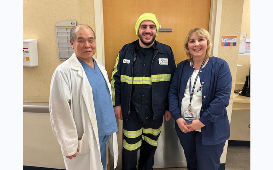 From left to right: Doctor Sherman Dunn, new dad Rafael Abitbul and nurse Anna Kolodynski. Dunn delivered Abitbul’s baby, the first for the NYC public hospital system in the new year, and later learned he had also delivered Abitbul himself, 23 years ago.