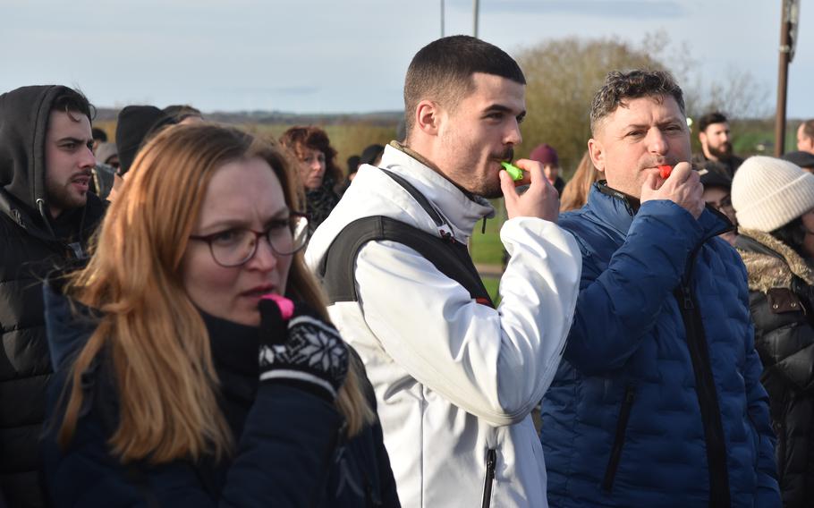 People protest outside a U.S. Air Force base in Germany.