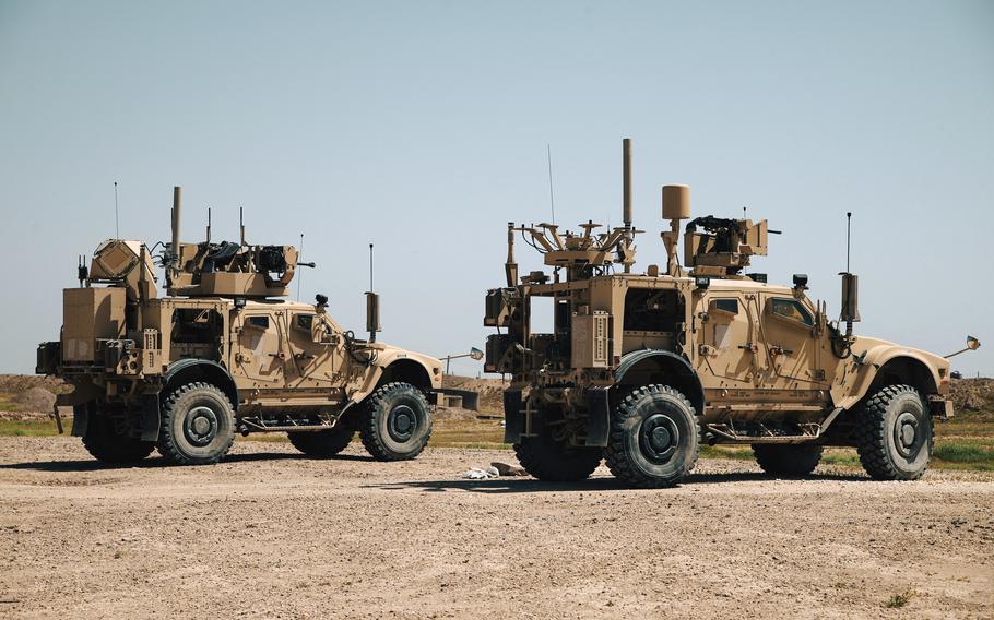 U.S. soldiers ride combat vehicles during an exercise in Syria in April 2024.