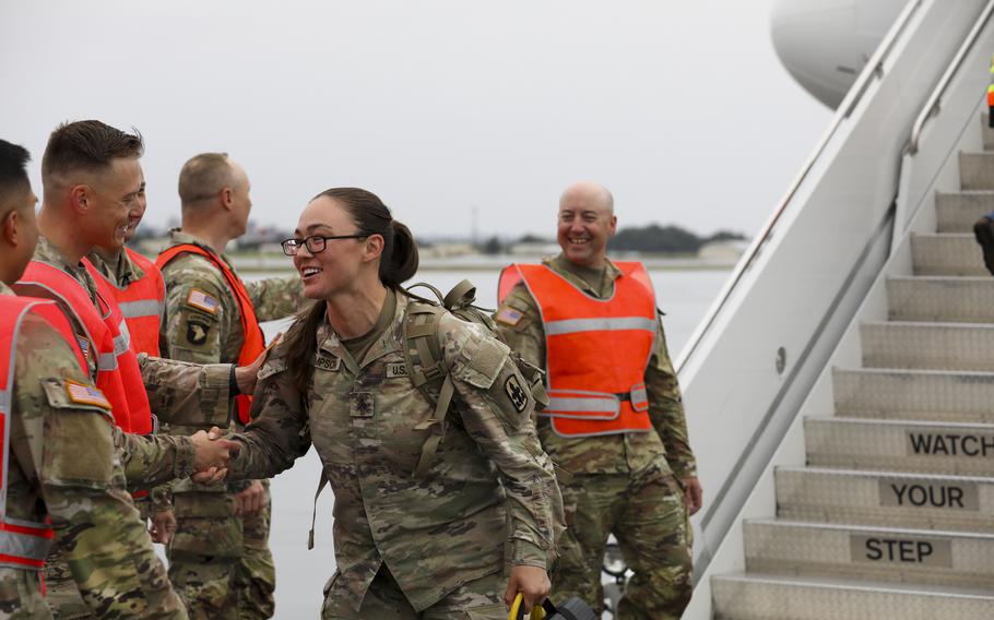 Friends and family members wait to reunite with their Alaska Army National Guardsmen during a welcome home event at the Alaska National Guard Readiness Center on Joint Base Elmendorf-Richardson, Aug. 10, 2024. 