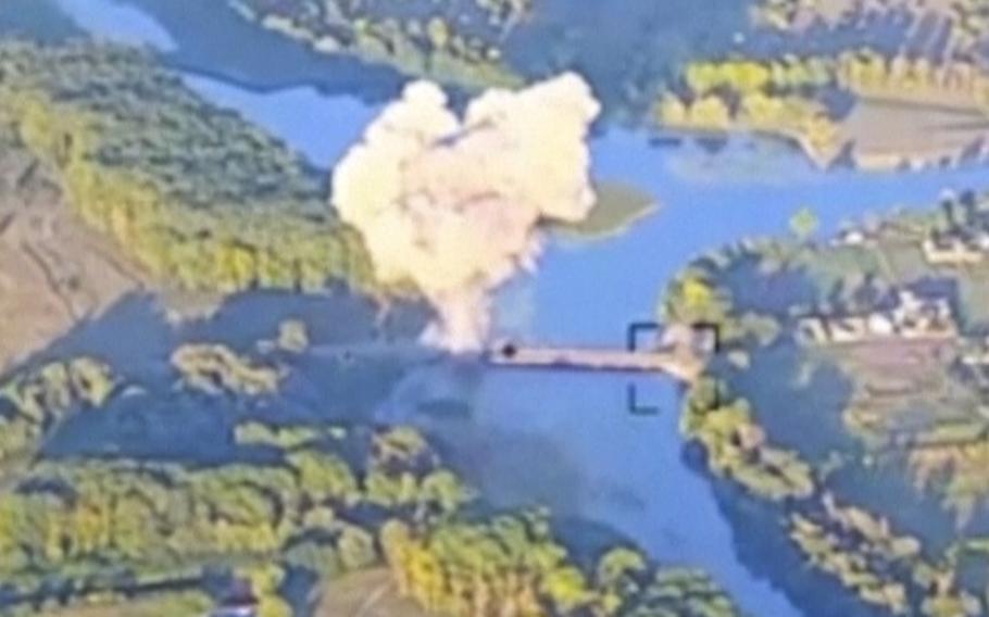 In this footage released by the Ukrainian armed forces on Sunday, Aug. 18, 2024, smoke billows in what is said to show the destruction of a key bridge in Russia’s Kursk region. 