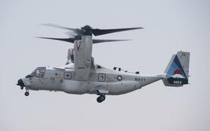 An Osprey aircraft flies in the air. 