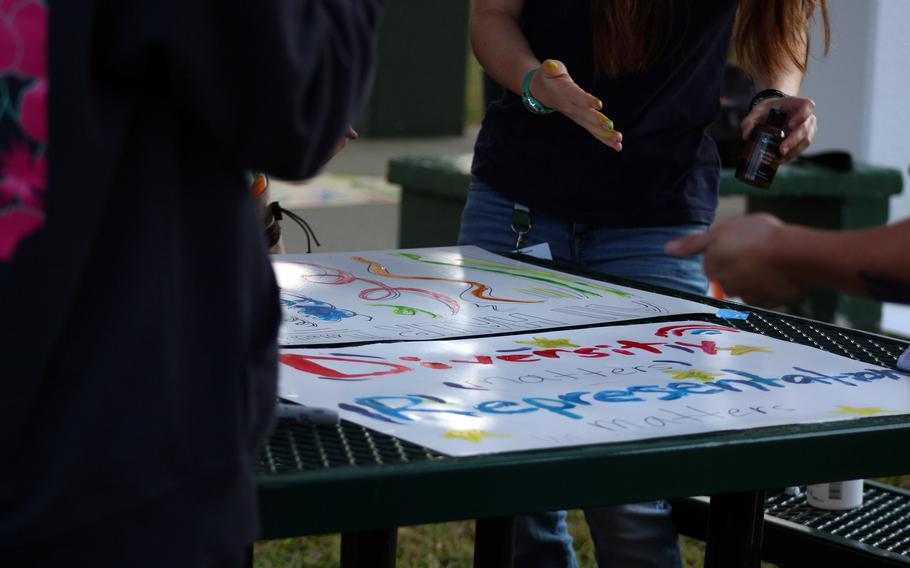 Students make protest signs.