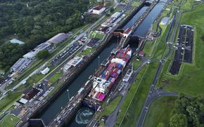 A cargo ship travels down the Panama Canal.