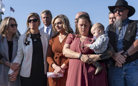 Families of American military members who were killed during the evacuation in Kabul, listen as House Foreign Affairs Committee Chairman Michael McCaul, R-Texas, speaks to reporters about his panel's Afghanistan Report and the findings of its three-year investigation into the U.S. withdrawal from Afghanistan, at the Capitol in Washington, Monday, Sept. 9, 2024. (AP Photo/J. Scott Applewhite)