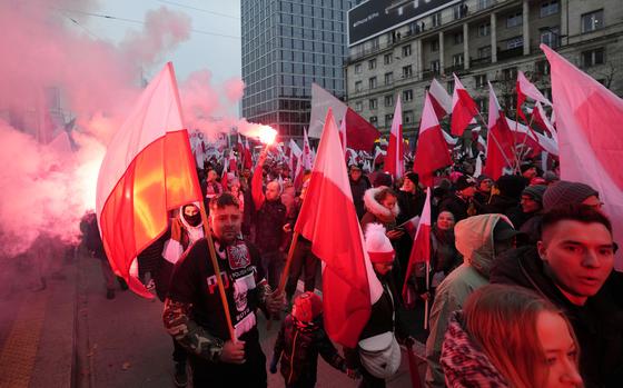 People take part in Independence Day march organized by far-right groups in Warsaw, Poland, Monday, Nov. 11, 2024. (AP Photo/Czarek Sokolowski)