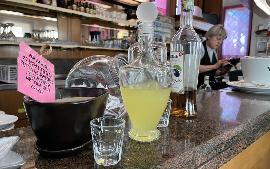 Limoncello and grappa are available for self-serve at the bar at Le Quattro Stagione in Longare, Italy. Customers often wait in line at the bar to pay their bill. 