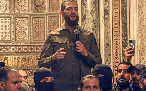 Abu Mohammed al-Golani speaks at the Umayyad Mosque in Damascus Sunday, Dec. 8, 2024. (AP Photo/Omar Albam)