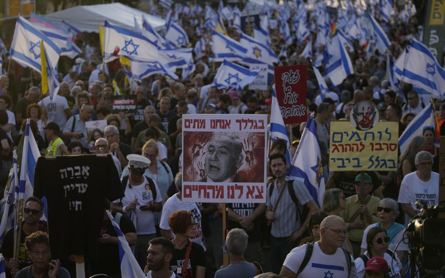 People take part in a protest in Jerusalem on June 17, 2024, against Israeli Prime Minister Benjamin Netanyahu’s government, demanding new elections and the release of the hostages held in Gaza.