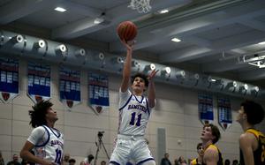 Ramstein's Michael Gonzales goes up for the shot during a game against SHAPE on Dec. 6, 2024, at Ramstein High School on Ramstein Air Base, Germany.